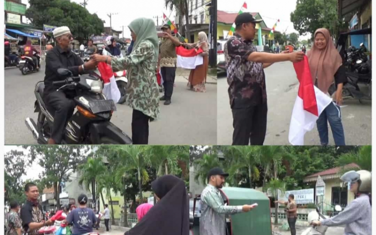 Intruksi Walikota Medan Bobby Nasution, Camat dan Lurah Denai Bagikan Ratusan Bendera ke Masyarakat
